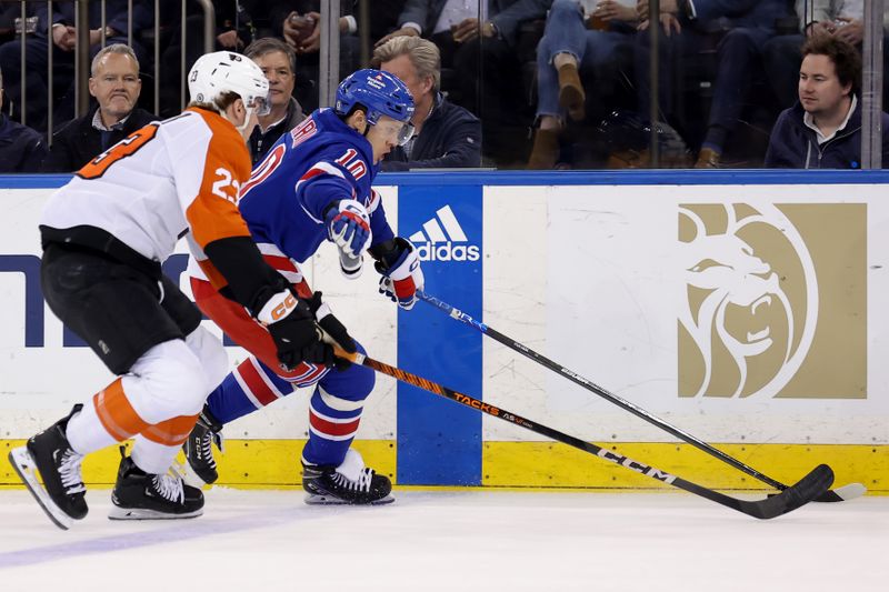 Mar 26, 2024; New York, New York, USA; New York Rangers left wing Artemi Panarin (10) skates with the puck against Philadelphia Flyers defenseman Ronnie Attard (23) during the first period at Madison Square Garden. Mandatory Credit: Brad Penner-USA TODAY Sports