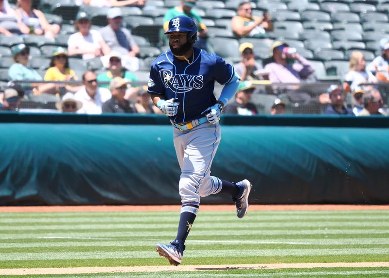 Jun 15, 2023; Oakland, California, USA; Tampa Bay Rays center fielder Manuel Margot (13) rounds the bases on a solo home run against the Oakland Athletics during the fourth inning at Oakland-Alameda County Coliseum. Mandatory Credit: Kelley L Cox-USA TODAY Sports