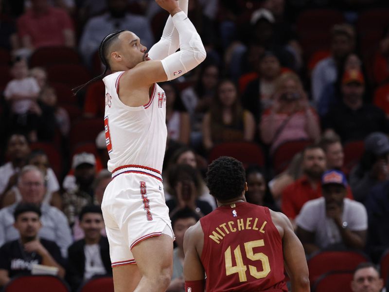 HOUSTON, TEXAS - MARCH 16: Dillon Brooks #9 of the Houston Rockets shoots over Donovan Mitchell #45 of the Cleveland Cavaliers during the first half at Toyota Center on March 16, 2024 in Houston, Texas. NOTE TO USER: User expressly acknowledges and agrees that, by downloading and or using this photograph, User is consenting to the terms and conditions of the Getty Images License Agreement. (Photo by Carmen Mandato/Getty Images)