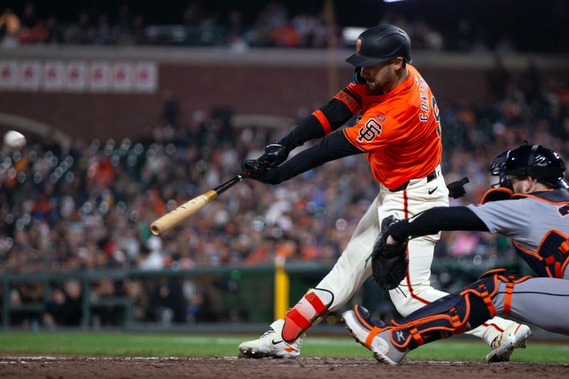 Aug 9, 2024; San Francisco, California, USA; San Francisco Giants left fielder Michael Conforto (8) hits a sacrifice fly against the Detroit Tigers during the seventh inning at Oracle Park. Mandatory Credit: D. Ross Cameron-USA TODAY Sports