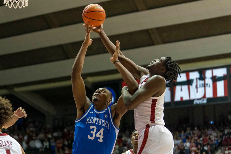 Jan 7, 2023; Tuscaloosa, Alabama, USA; Alabama Crimson Tide center Charles Bediako (14) goes for a rebound along with Kentucky Wildcats forward Oscar Tshiebwe (34) during first half at Coleman Coliseum. Mandatory Credit: Marvin Gentry-USA TODAY Sports