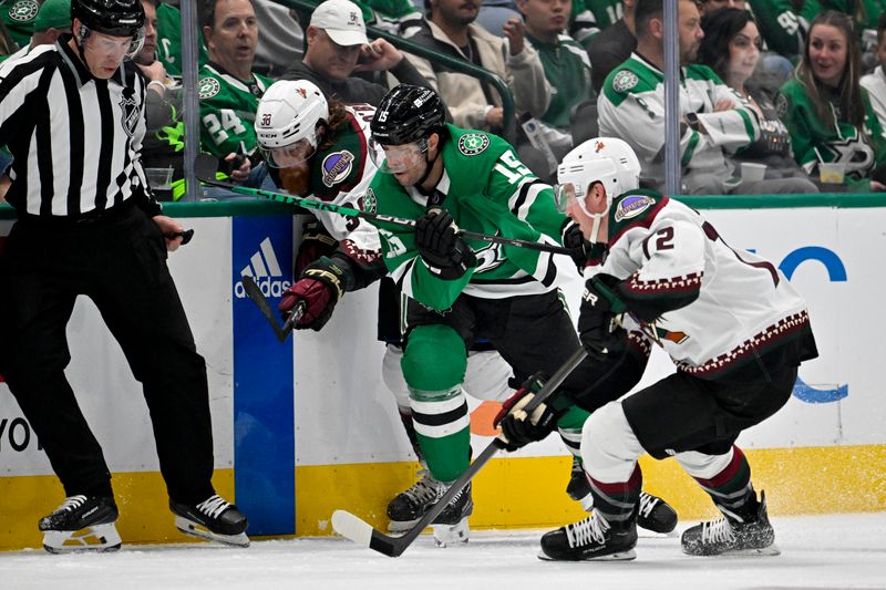 Nov 14, 2023; Dallas, Texas, USA; Arizona Coyotes center Liam O'Brien (38) and Dallas Stars center Craig Smith (15) battle for control of the puck during the first period at the American Airlines Center. Mandatory Credit: Jerome Miron-USA TODAY Sports