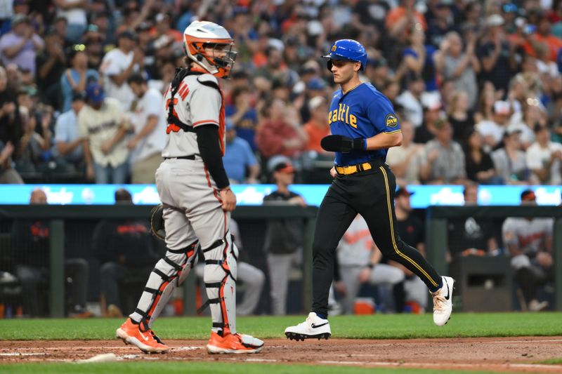 Aug 11, 2023; Seattle, Washington, USA; Seattle Mariners designated hitter Dominic Canzone (8) scores a run against the Baltimore Orioles during the fourth inning at T-Mobile Park. Mandatory Credit: Steven Bisig-USA TODAY Sports