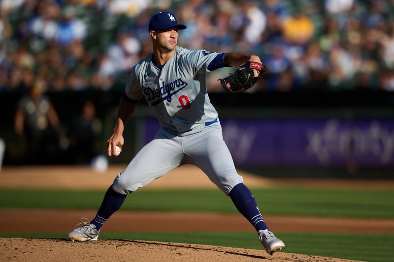 Aug 3, 2024; Oakland, California, USA; Los Angeles Dodgers starting pitcher Jack Flaherty (0) throws  against the Oakland Athletics during the first inning at Oakland-Alameda County Coliseum. Mandatory Credit: Robert Edwards-USA TODAY Sports