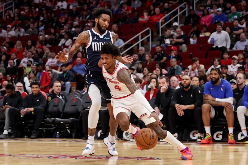 HOUSTON, TEXAS - DECEMBER 22: Jalen Green #4 of the Houston Rockets drives to the basket while defended by Derrick Jones Jr. #55 of the Dallas Mavericks in the second half at Toyota Center on December 22, 2023 in Houston, Texas.   NOTE TO USER: User expressly acknowledges and agrees that, by downloading and or using this photograph, User is consenting to the terms and conditions of the Getty Images License Agreement. (Photo by Tim Warner/Getty Images)