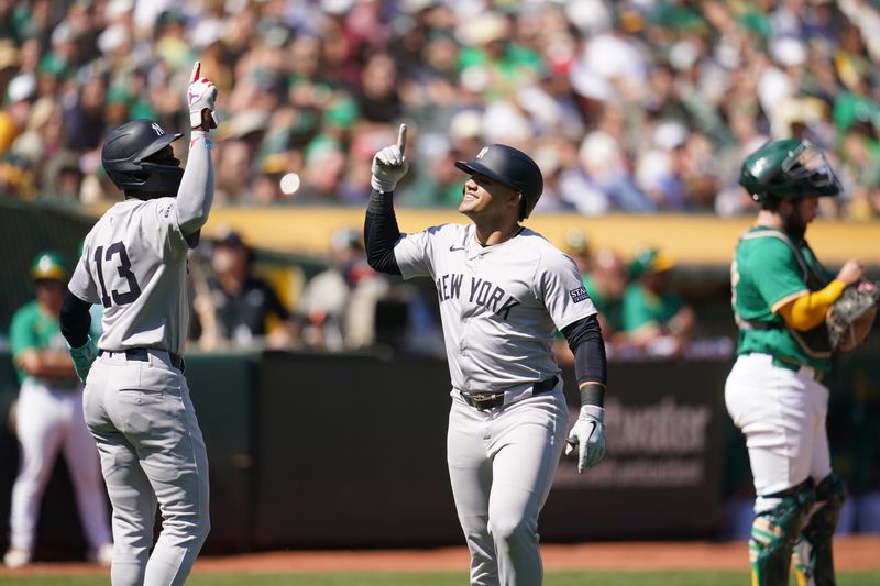 Sep 22, 2024; Oakland, California, USA; New York Yankees left fielder Jasson Dominguez (89) celebrates with third baseman Jazz Chisholm Jr. (13) after hitting a two-run home run against the Oakland Athletics in the second inning at the Oakland-Alameda County Coliseum. Mandatory Credit: Cary Edmondson-Imagn Images