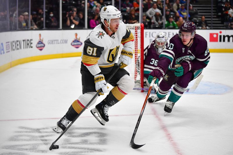 Dec 27, 2023; Anaheim, California, USA; Vegas Golden Knights right wing Jonathan Marchessault (81) moves the puck against Anaheim Ducks defenseman Jackson LaCombe (60) during the second period at Honda Center. Mandatory Credit: Gary A. Vasquez-USA TODAY Sports