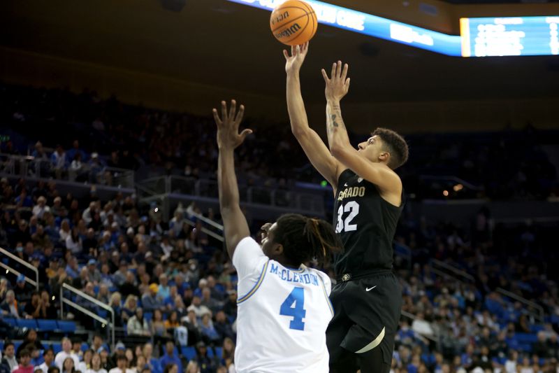 Jan 14, 2023; Los Angeles, California, USA;  Colorado Buffaloes guard Nique Clifford (32) shoots the ball against UCLA Bruins guard Will McClendon (4) during the first half at Pauley Pavilion presented by Wescom. Mandatory Credit: Kiyoshi Mio-USA TODAY Sports