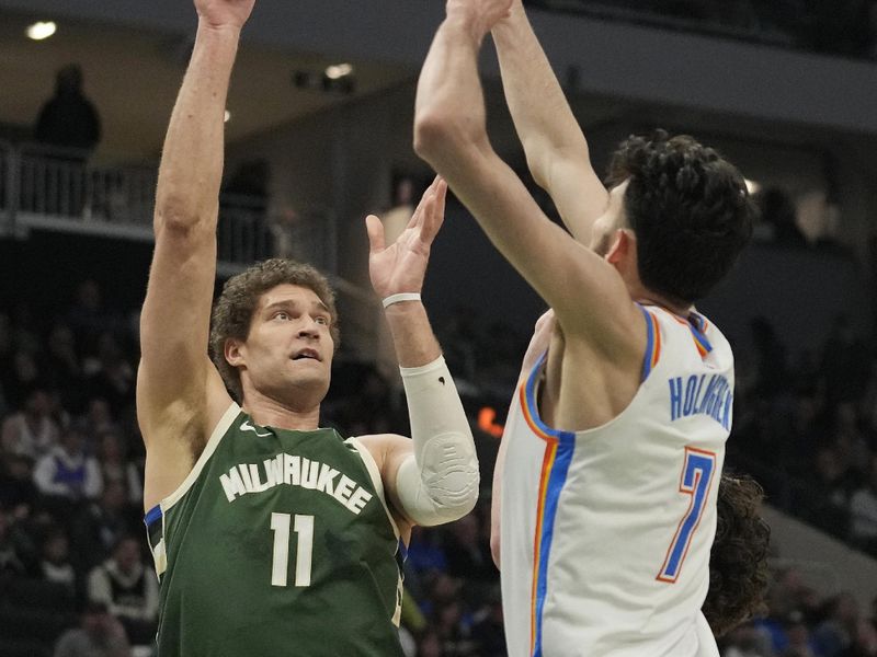 MILWAUKEE, WISCONSIN - MARCH 24: Brook Lopez #11 of the Milwaukee Bucks shoots  against Chet Holmgren #7 of the Oklahoma City Thunder during the second half at Fiserv Forum on March 24, 2024 in Milwaukee, Wisconsin. NOTE TO USER: User expressly acknowledges and agrees that, by downloading and or using this photograph, User is consenting to the terms and conditions of the Getty Images License Agreement. (Photo by Patrick McDermott/Getty Images)