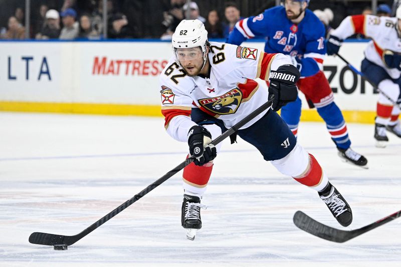 May 30, 2024; New York, New York, USA; Florida Panthers defenseman Brandon Montour (62) passes against the New York Rangers during the second period in game five of the Eastern Conference Final of the 2024 Stanley Cup Playoffs at Madison Square Garden. Mandatory Credit: Dennis Schneidler-USA TODAY Sports