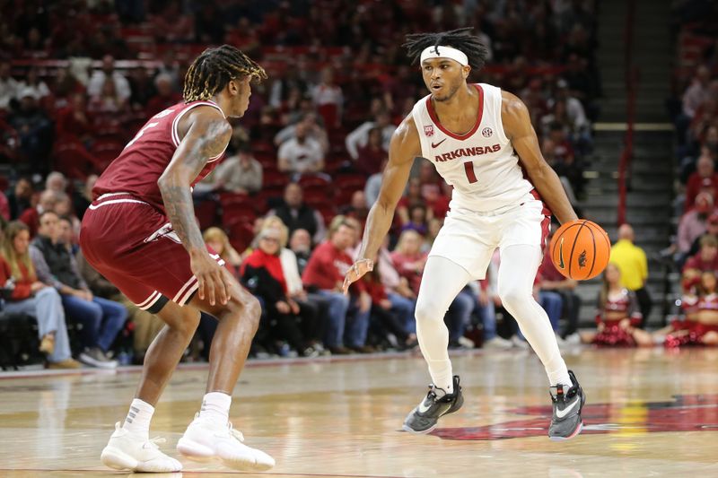 Nov 28, 2022; Fayetteville, Arkansas, USA; Arkansas Razorbacks guard Ricky Council IV (1) drives against Troy Trojans guard Chirstyon Eugene (5) in the second half at Bud Walton Arena. Arkansas won 74-61. Mandatory Credit: Nelson Chenault-USA TODAY Sports