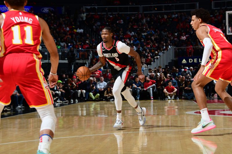 ATLANTA, GA - MARCH 3: Cam Reddish #5 of the Portland Trail Blazers dribbles the ball during the game against the Atlanta Hawks on March 3, 2023 at State Farm Arena in Atlanta, Georgia.  NOTE TO USER: User expressly acknowledges and agrees that, by downloading and/or using this Photograph, user is consenting to the terms and conditions of the Getty Images License Agreement. Mandatory Copyright Notice: Copyright 2023 NBAE (Photo by Scott Cunningham/NBAE via Getty Images)