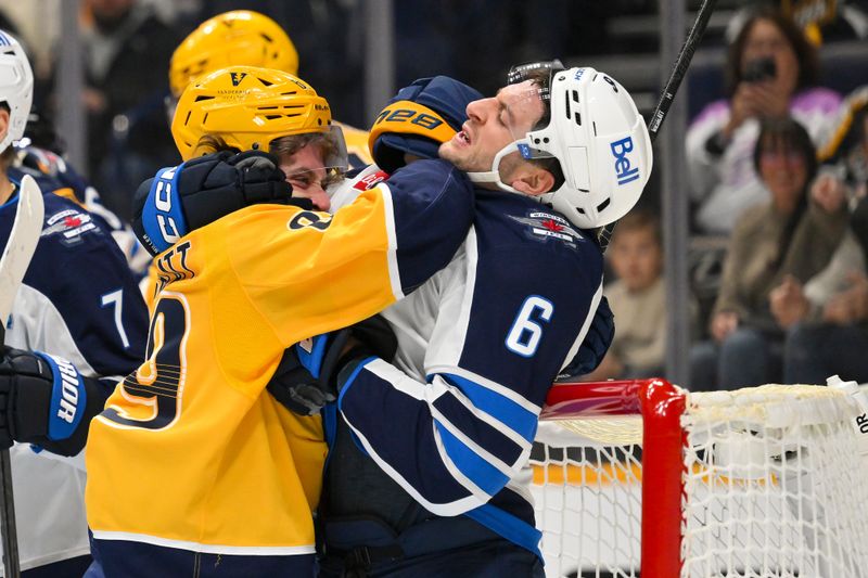 Nov 29, 2025; Nashville, Tennessee, USA;  Nashville Predators right wing Ozzy Weisblatt (89) battles with Winnipeg Jets defenseman Colin Miller (6) in front of the net during the first period at Bridgestone Arena. Mandatory Credit: Steve Roberts-Imagn Images