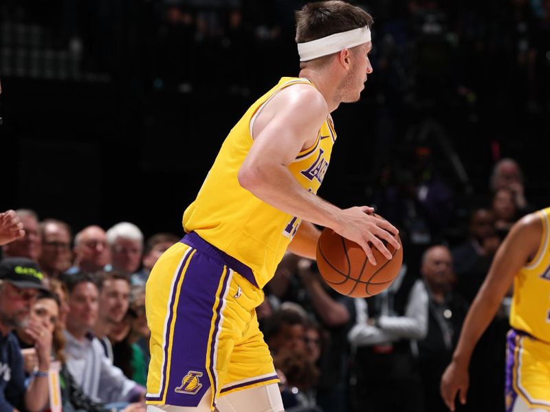MINNEAPOLIS, MN -  APRIL 25:    Austin Reaves #15 of the Los Angeles Lakers dribbles the ball during the game against the Minnesota Timberwolves during Round 1 Game 3 of the 2025 NBA Playoffs  on April 25, 2025 at Target Center in Minneapolis, Minnesota. NOTE TO USER: User expressly acknowledges and agrees that, by downloading and or using this Photograph, user is consenting to the terms and conditions of the Getty Images License Agreement. Mandatory Copyright Notice: Copyright 2025 NBAE (Photo by David Sherman/NBAE via Getty Images)