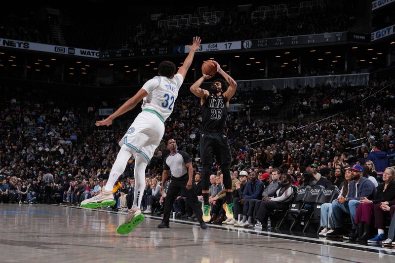 BROOKLYN, NY - JANUARY 25: Spencer Dinwiddie #26 of the Brooklyn Nets shoots a three point basket against the Minnesota Timberwolves on January 25, 2024 at Barclays Center in Brooklyn, New York. NOTE TO USER: User expressly acknowledges and agrees that, by downloading and or using this Photograph, user is consenting to the terms and conditions of the Getty Images License Agreement. Mandatory Copyright Notice: Copyright 2024 NBAE (Photo by Jesse D. Garrabrant/NBAE via Getty Images)