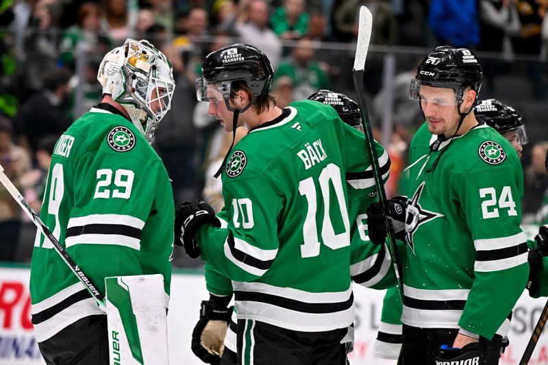 Nov 14, 2024; Dallas, Texas, USA; Dallas Stars goaltender Jake Oettinger (29) and Dallas Stars center Oskar Back (10) celebrate the win over the Boston Bruins at the American Airlines Center. Mandatory Credit: Jerome Miron-Imagn Images