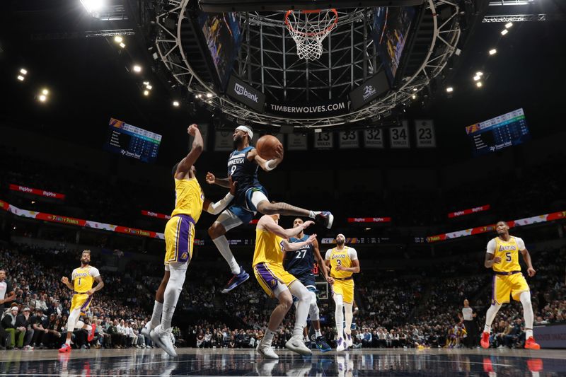 MINNEAPOLIS, MN -  DECEMBER 13: Nickeil Alexander-Walker #9 of the Minnesota Timberwolves rebounds the ball during the game against the Los Angeles Lakers on December 13, 2024 at Target Center in Minneapolis, Minnesota. NOTE TO USER: User expressly acknowledges and agrees that, by downloading and or using this Photograph, user is consenting to the terms and conditions of the Getty Images License Agreement. Mandatory Copyright Notice: Copyright 2024 NBAE (Photo by Jordan Johnson/NBAE via Getty Images)