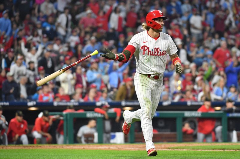 May 19, 2024; Philadelphia, Pennsylvania, USA; Philadelphia Phillies second base Bryson Stott (5) hits a home run during the seventh inning against the Washington Nationals at Citizens Bank Park. Mandatory Credit: Eric Hartline-USA TODAY Sports