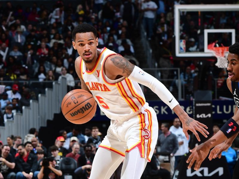 ATLANTA, GA - APRIL 3: Dejounte Murray #5 of the Atlanta Hawks dribbles the ball during the game against the Detroit Pistons on April 3, 2024 at State Farm Arena in Atlanta, Georgia.  NOTE TO USER: User expressly acknowledges and agrees that, by downloading and/or using this Photograph, user is consenting to the terms and conditions of the Getty Images License Agreement. Mandatory Copyright Notice: Copyright 2024 NBAE (Photo by Scott Cunningham/NBAE via Getty Images)