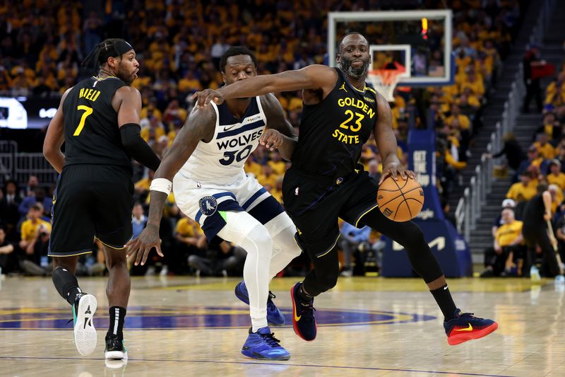 SAN FRANCISCO, CALIFORNIA - MAY 12: Draymond Green #23 of the Golden State Warriors dribbles the ball against Julius Randle #30 of the Minnesota Timberwolves during the third quarter in Game Four of the Western Conference Second Round NBA Playoffs at Chase Center on May 12, 2025 in San Francisco, California. NOTE TO USER: User expressly acknowledges and agrees that, by downloading and or using this photograph, User is consenting to the terms and conditions of the Getty Images License Agreement. (Photo by Ezra Shaw/Getty Images)