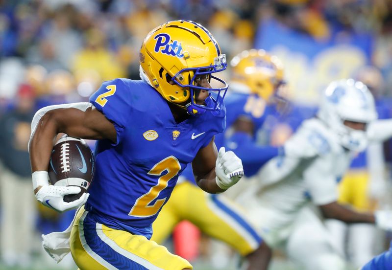 Sep 23, 2023; Pittsburgh, Pennsylvania, USA; Pittsburgh Panthers wide receiver Kenny Johnson (2) returns a kick-off for a ninety-nine yard touchdown against the North Carolina Tar Heels during the third quarter at Acrisure Stadium. Mandatory Credit: Charles LeClaire-USA TODAY Sports