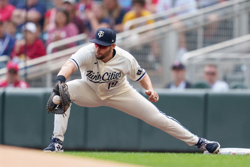 Sep 24, 2023; Minneapolis, Minnesota, USA; Minnesota Twins first baseman Alex Kirilloff (19) catches a throw from shortstop Kyle Farmer (12) to retire Los Angeles Angels first baseman Brandon Drury (23) and end the first inning at Target Field. Mandatory Credit: Matt Blewett-USA TODAY Sports