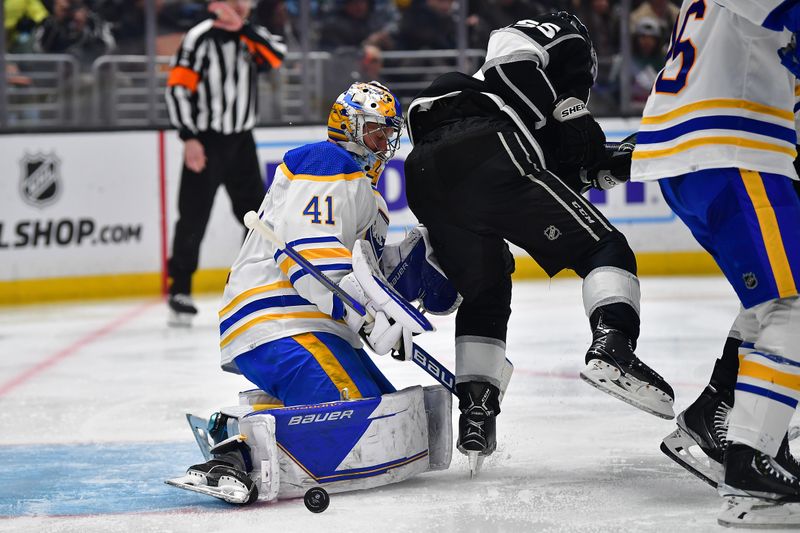 Feb 13, 2023; Los Angeles, California, USA; Buffalo Sabres goaltender Craig Anderson (41) blocks a shot against Los Angeles Kings center Quinton Byfield (55) during the second period at Crypto.com Arena. Mandatory Credit: Gary A. Vasquez-USA TODAY Sports