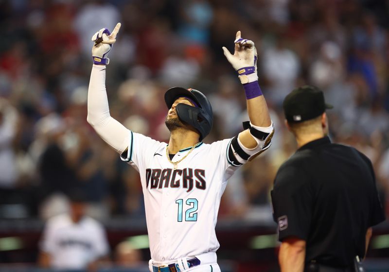 Aug 27, 2023; Phoenix, Arizona, USA; Arizona Diamondbacks outfielder Lourdes Gurriel Jr. celebrates a seventh inning solo home run against the Cincinnati Reds at Chase Field. Mandatory Credit: Mark J. Rebilas-USA TODAY Sports