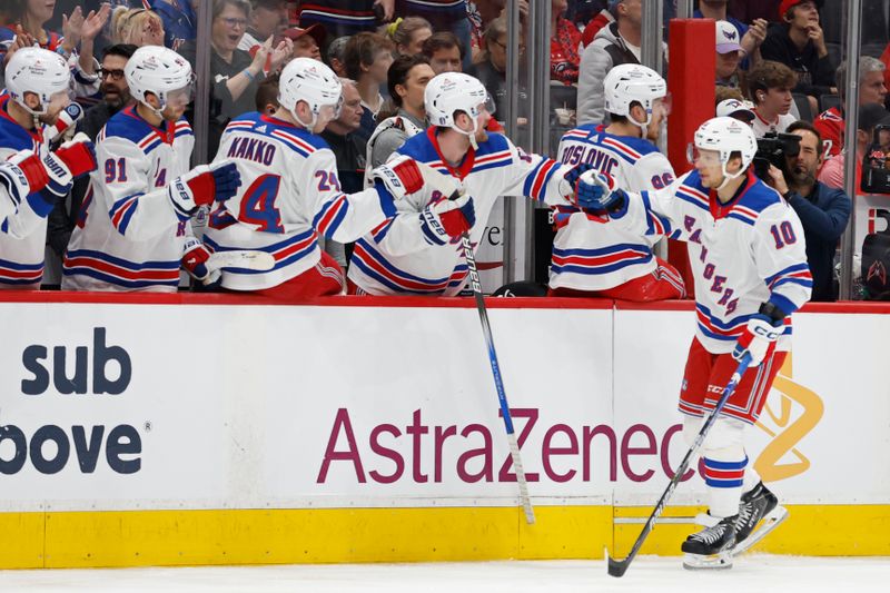 Apr 28, 2024; Washington, District of Columbia, USA; New York Rangers left wing Artemi Panarin (10) celebrates with teammates after scoring a goal /W? in the third period in game four of the first round of the 2024 Stanley Cup Playoffs at Capital One Arena. Mandatory Credit: Geoff Burke-USA TODAY Sports