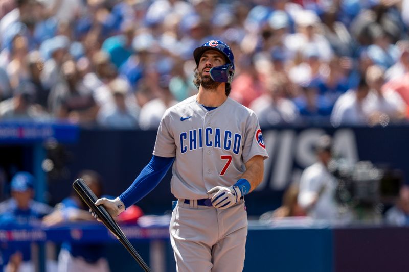 Aug 13, 2023; Toronto, Ontario, CAN; Chicago Cubs shortstop Dansby Swanson (7) tracks a foul ball during the fourth inning against the Toronto Blue Jays at Rogers Centre. Mandatory Credit: Kevin Sousa-USA TODAY Sports