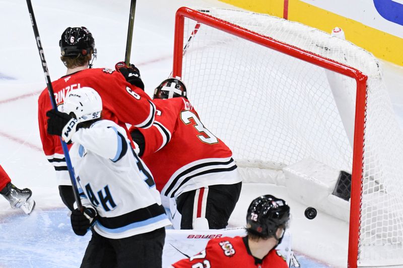 Oct 13, 2025; Chicago, Illinois, USA;  Chicago Blackhawks players look on after Utah Mammoth right wing JJ Peterka (77) scores during the third period at United Center. Mandatory Credit: Matt Marton-Imagn Images