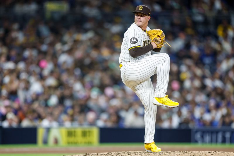 Jun 9, 2025; San Diego, California, USA; San Diego Padres relief pitcher Adrian Morejon (50) throws a pitch during the eighth inning against the Los Angeles Dodgers at Petco Park. Mandatory Credit: David Frerker-Imagn Images