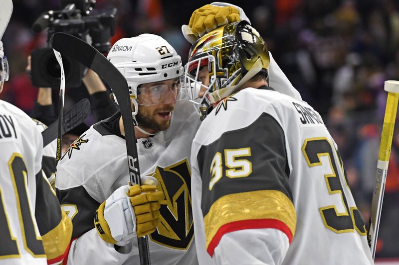 Nov 25, 2024; Philadelphia, Pennsylvania, USA; Vegas Golden Knights defenseman Shea Theodore (27) and  goaltender Ilya Samsonov (35) celebrate win against the Philadelphia Flyers at Wells Fargo Center. Mandatory Credit: Eric Hartline-Imagn Images