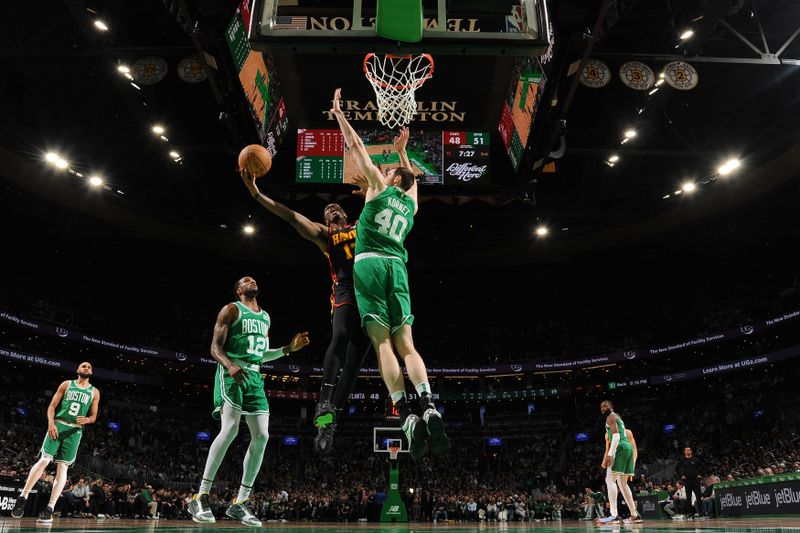 BOSTON, MA - FEBRUARY 7: Onyeka Okongwu #17 of the Atlanta Hawks drives to the basket during the game against the Boston Celtics on February 7, 2024 at the TD Garden in Boston, Massachusetts. NOTE TO USER: User expressly acknowledges and agrees that, by downloading and or using this photograph, User is consenting to the terms and conditions of the Getty Images License Agreement. Mandatory Copyright Notice: Copyright 2024 NBAE  (Photo by Brian Babineau/NBAE via Getty Images)