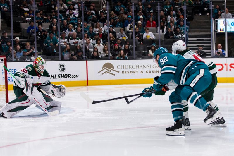 Dec 31, 2025; San Jose, California, USA;  San Jose Sharks left wing Igor Chernyshov (92) shoots and scores against Minnesota Wild goaltender Jesper Wallstedt (30) during the second period at SAP Center at San Jose. Mandatory Credit: John Hefti-Imagn Images