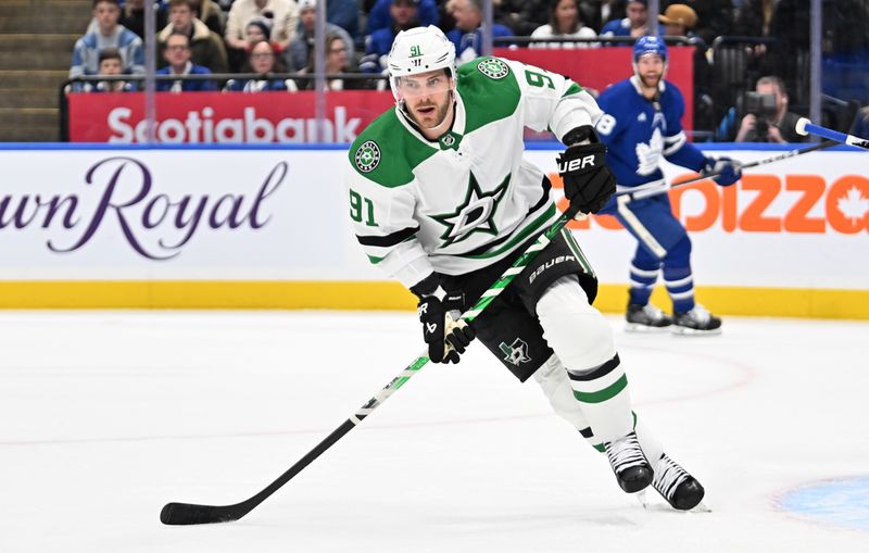 Feb 7, 2024; Toronto, Ontario, CAN; Dallas Stars forward Tyler Seguin (91) pursues the play against the Toronto Maple Leafs in the first period at Scotiabank Arena. Mandatory Credit: Dan Hamilton-USA TODAY Sports