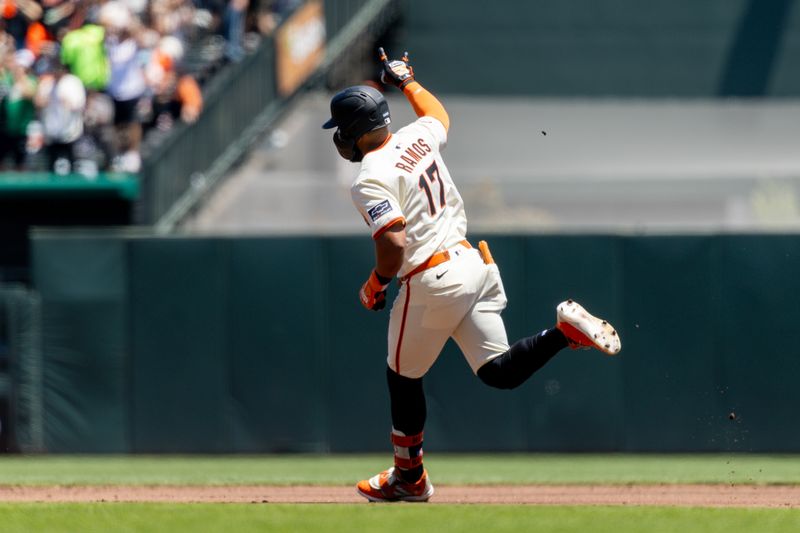 May 18, 2025; San Francisco, California, USA; San Francisco Giants outfielder Heliot Ramos (17) rounds the bases after hitting a solo home run during the first inning against the Oakland Athletics at Oracle Park. Mandatory Credit: Bob Kupbens-Imagn Images