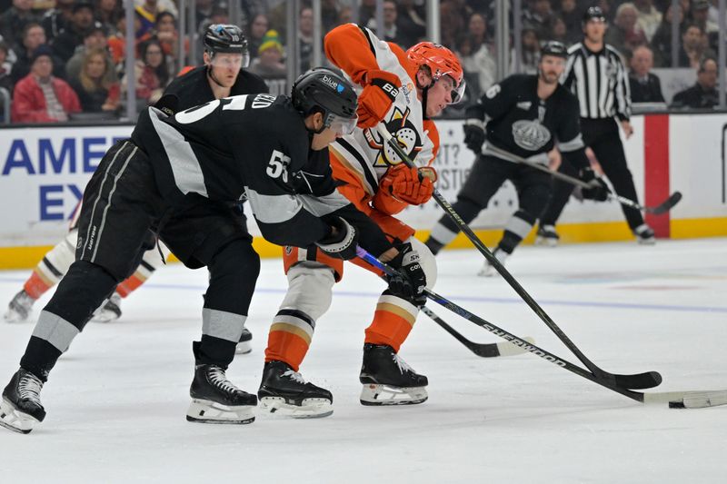Dec 27, 2025; Los Angeles, California, USA; Los Angeles Kings right wing Quinton Byfield (55) and Anaheim Ducks defenseman Jackson Lacombe (2) vie for the puck during the second period at Crypto.com Arena. Mandatory Credit: Jayne Kamin-Oncea-Imagn Images
