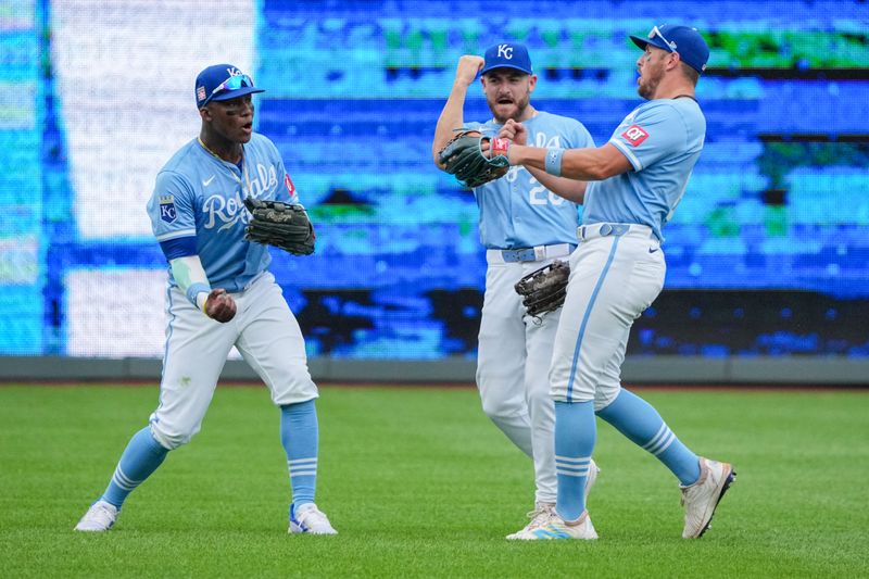 Jul 21, 2024; Kansas City, Missouri, USA; Kansas City Royals left fielder Dairon Blanco (44) and center fielder Kyle Isbel (28) and right fielder Hunter Renfroe (16) celebrate in the outfield after the win over the Chicago White Sox at Kauffman Stadium. Mandatory Credit: Denny Medley-USA TODAY Sports