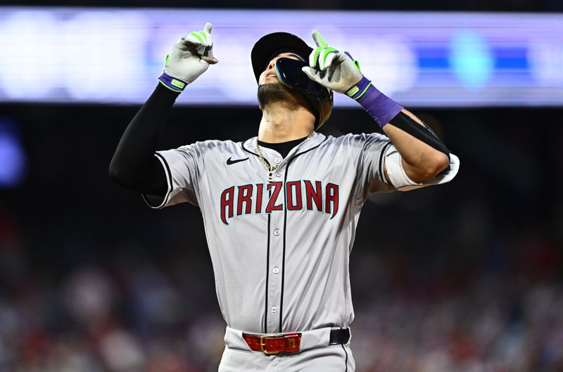 Jun 21, 2024; Philadelphia, Pennsylvania, USA; Arizona Diamondbacks outfielder Lourdes Gurriel Jr (12) reacts after hitting a single against the Philadelphia Phillies in the sixth inning at Citizens Bank Park. Mandatory Credit: Kyle Ross-USA TODAY Sports