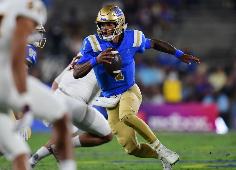 Oct 2, 2021; Pasadena, California, USA; UCLA Bruins quarterback Dorian Thompson-Robinson (1) runs the ball against the Arizona State Sun Devils during the first half at Rose Bowl. Mandatory Credit: Gary A. Vasquez-USA TODAY Sports