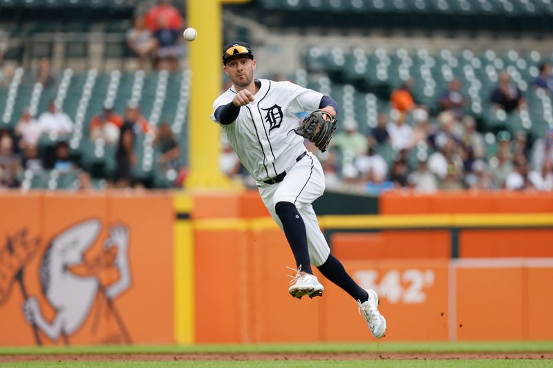 Jun 26, 2024; Detroit, Michigan, USA;  Detroit Tigers shortstop Ryan Kreidler (32) makes a throw against the Philadelphia Phillies in the third inning at Comerica Park. Mandatory Credit: Rick Osentoski-USA TODAY Sports