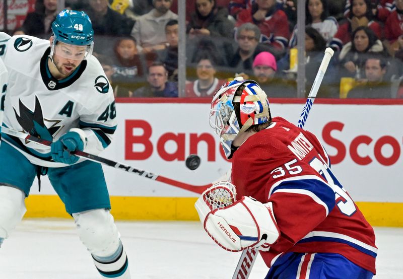 Jan 11, 2024; Montreal, Quebec, CAN; Montreal Canadiens goalie Sam Montembeault (35) stops San Jose Sharks forward Tomas Hertl (48) during the second period at the Bell Centre. Mandatory Credit: Eric Bolte-USA TODAY Sports