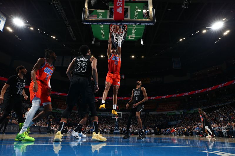 OKLAHOMA CITY, OK - MARCH 14: Ousmane Dieng #13 of the Oklahoma City Thunder drives to the basket during the game against the Brooklyn Nets on March 14, 2023 at Paycom Arena in Oklahoma City, Oklahoma. NOTE TO USER: User expressly acknowledges and agrees that, by downloading and or using this photograph, User is consenting to the terms and conditions of the Getty Images License Agreement. Mandatory Copyright Notice: Copyright 2023 NBAE (Photo by Zach Beeker/NBAE via Getty Images)