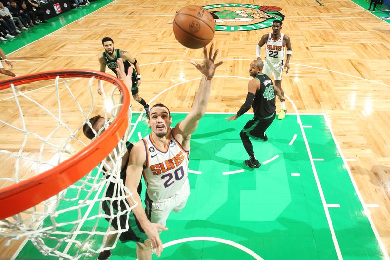 BOSTON, MA - FEBRUARY 3: Dario Saric #20 of the Phoenix Suns rebounds the ball during the game against the Boston Celtics on February 3, 2023 at TD Garden in Boston, Massachusetts.  NOTE TO USER: User expressly acknowledges and agrees that, by downloading and or using this photograph, User is consenting to the terms and conditions of the Getty Images License Agreement. Mandatory Copyright Notice: Copyright 2022 NBAE  (Photo by Nathaniel S. Butler/NBAE via Getty Images)