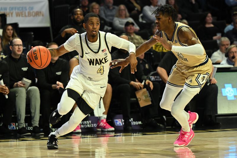 Feb 11, 2023; Winston-Salem, North Carolina, USA; Wake Forest Demon Deacons guard Daivien Williamson (4) drives around Georgia Tech Yellow Jackets guard Miles Kelly (13) during the first half at Lawrence Joel Veterans Memorial Coliseum. Mandatory Credit: William Howard-USA TODAY Sports