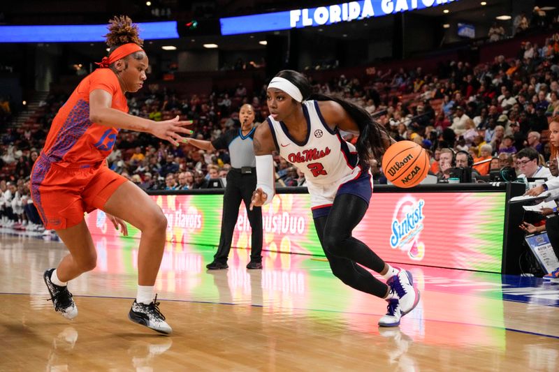 Mar 8, 2024; Greensville, SC, USA; Ole Miss Rebels guard Marquesha Davis (2) drives to the basket against Florida Gators guard Laila Reynolds (13) during the first half at Bon Secours Wellness Arena. Mandatory Credit: Jim Dedmon-USA TODAY Sports