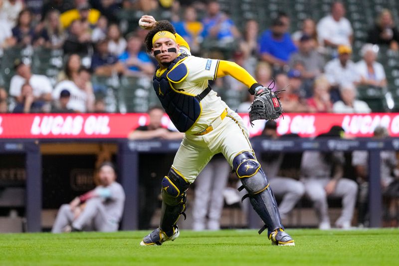 Sep 19, 2024; Milwaukee, Wisconsin, USA;  Milwaukee Brewers catcher William Contreras (24) throws to first base during the fourth inning against the Arizona Diamondbacks  at American Family Field. Mandatory Credit: Jeff Hanisch-Imagn Images