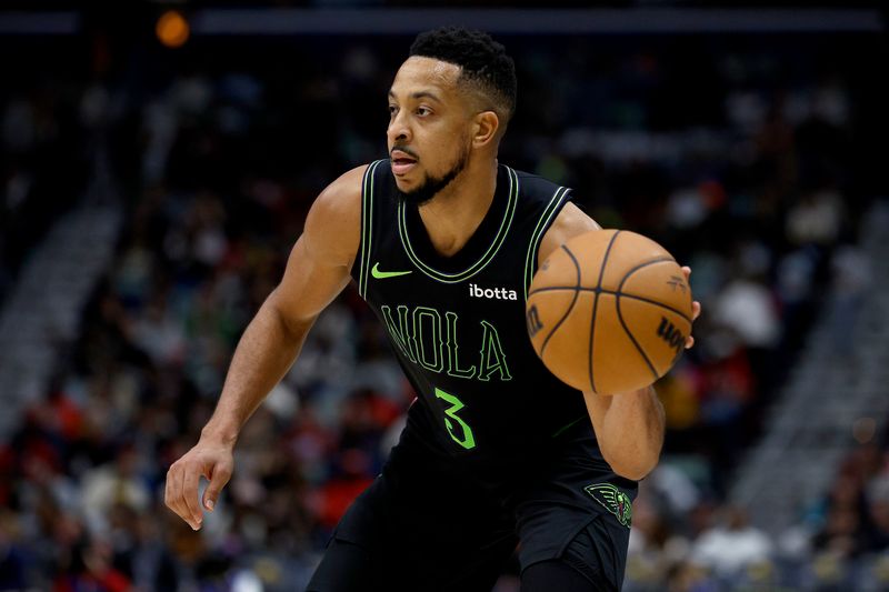 NEW ORLEANS, LOUISIANA - JANUARY 23: CJ McCollum #3 of the New Orleans Pelicans dribbles the ball down court during the third quarter of an NBA game against the Utah Jazz at Smoothie King Center on January 23, 2024 in New Orleans, Louisiana. NOTE TO USER: User expressly acknowledges and agrees that, by downloading and or using this photograph, User is consenting to the terms and conditions of the Getty Images License Agreement. (Photo by Sean Gardner/Getty Images)