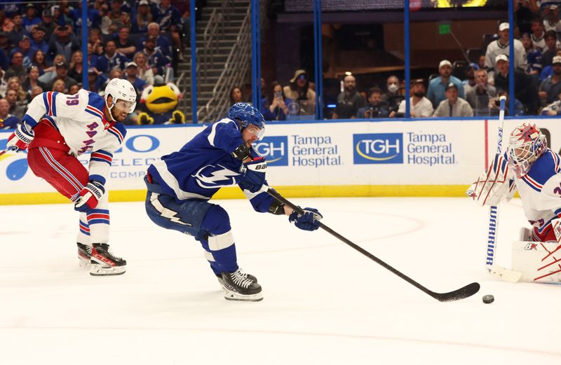 Mar 14, 2024; Tampa, Florida, USA; Tampa Bay Lightning right wing Nikita Kucherov (86) shoots on New York Rangers goaltender Igor Shesterkin (31) as defenseman K'Andre Miller (79) defends during the third period at Amalie Arena. Mandatory Credit: Kim Klement Neitzel-USA TODAY Sports